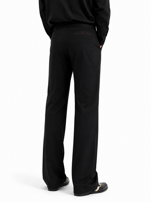 Black tailored wide-leg trousers — back view showing heartbeat embroidery at waistband