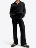 Black viscose blend wide-leg trousers — front view styled with black satin shirt