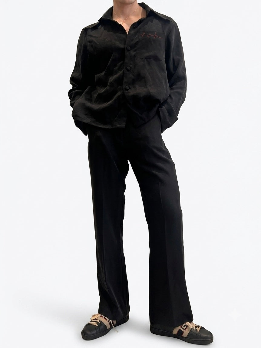 Black viscose blend wide-leg trousers — front view styled with black satin shirt